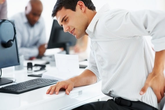 A Seated Man in Pain - Photo courtesy of ©iStockphoto.com/Yuri_Arcurs, Image #17304134